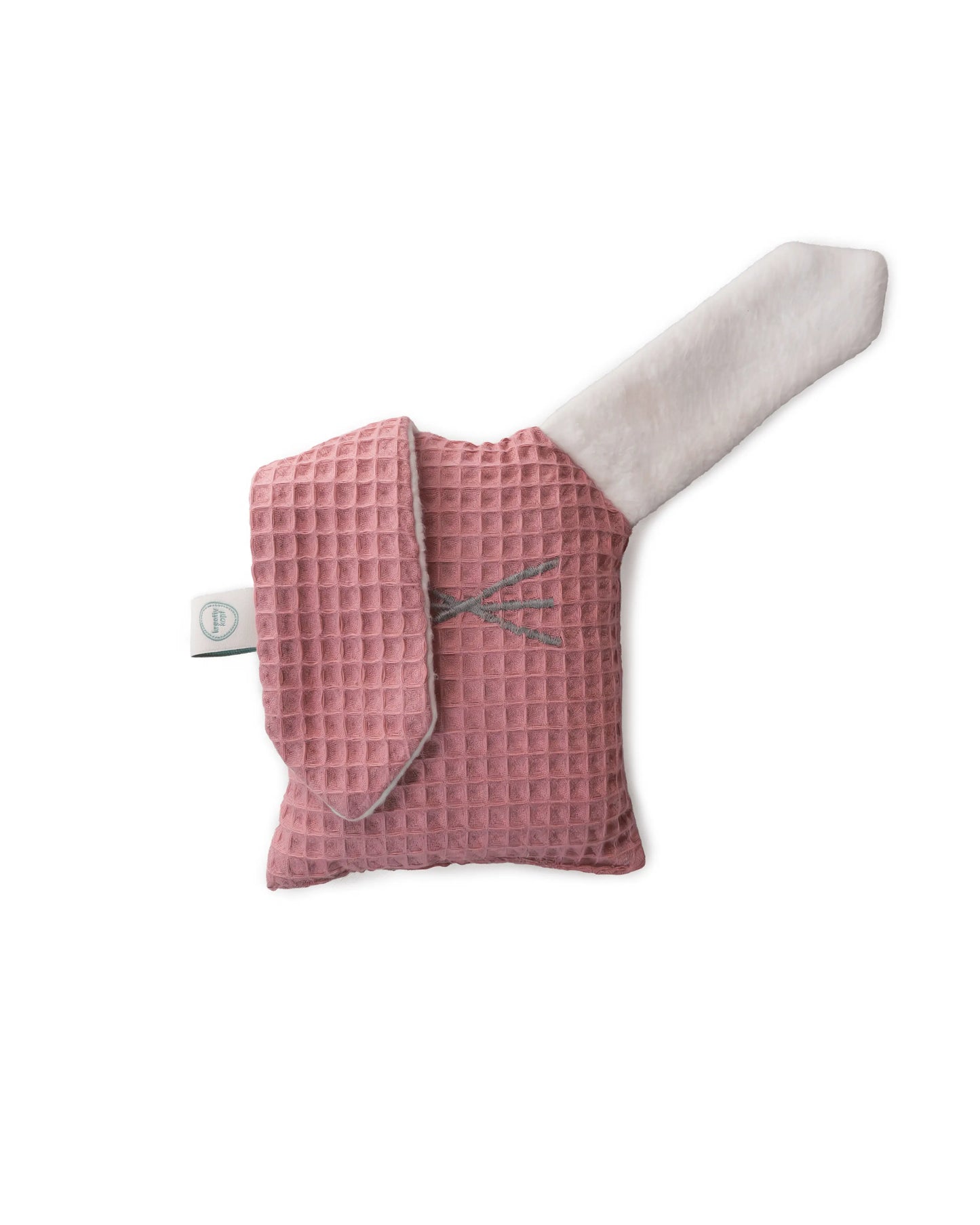 Rosa Kuscheltier Zirbenhase Hopsi auf weißem Hintergrund